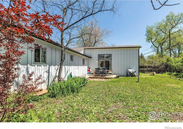 3100 Denton Ave, Boulder, CO 80303 - back of property with board and batten siding and a patio area
