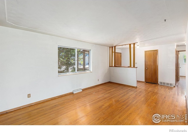 1207 S Tyler Ave, Loveland, CO 80537 - empty room featuring plenty of natural light and wood finished floors