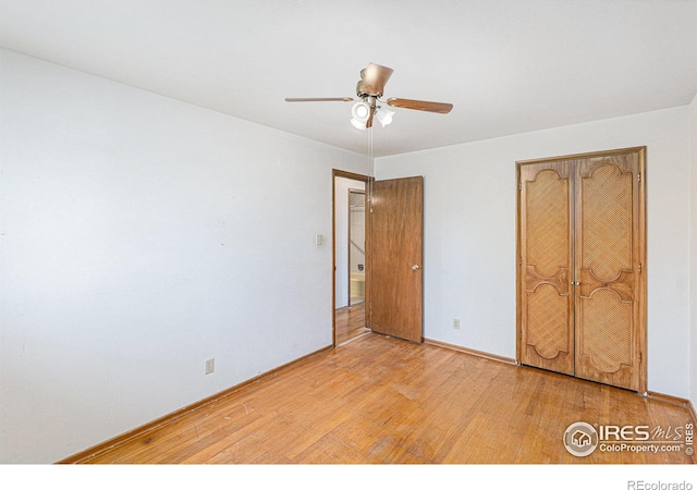 1207 S Tyler Ave, Loveland, CO 80537 - unfurnished bedroom featuring light wood-style flooring, baseboards, ceiling fan, and a closet