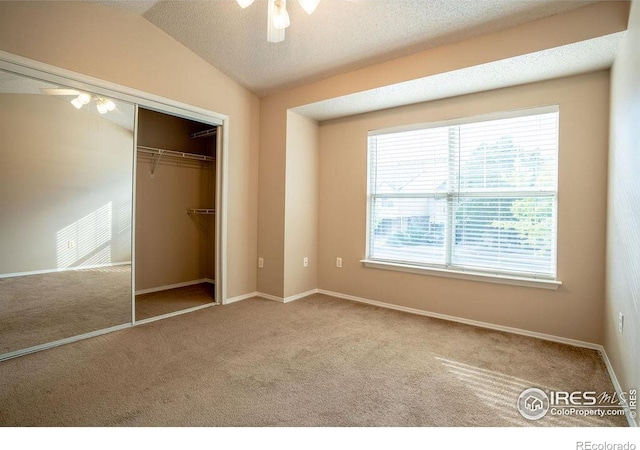 2092 N Concord Ln, Superior, CO 80027 - unfurnished bedroom with carpet floors, a closet, baseboards, a ceiling fan, and lofted ceiling