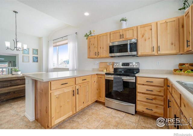 kitchen featuring appliances with stainless steel finishes, light brown cabinets, a peninsula, light countertops, and vaulted ceiling