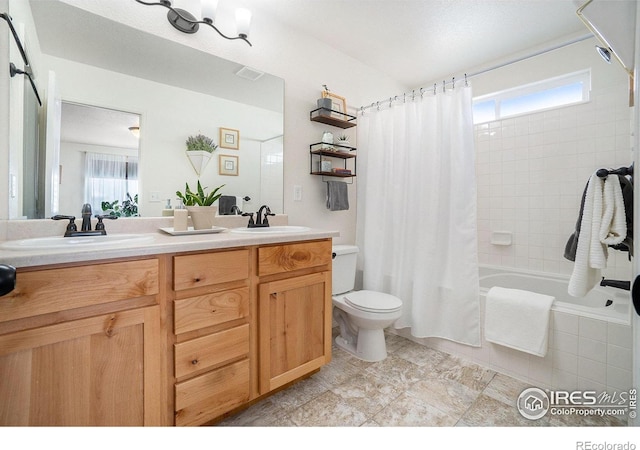bathroom with toilet, shower / bath combo, double vanity, and tile patterned floors