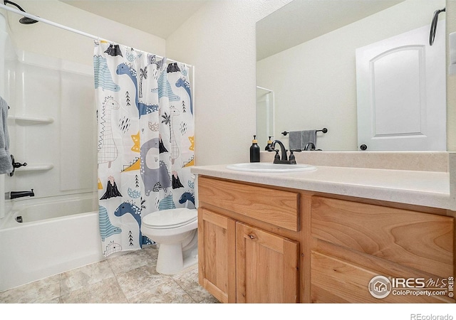 full bathroom featuring toilet, vanity, and shower / bath combo with shower curtain
