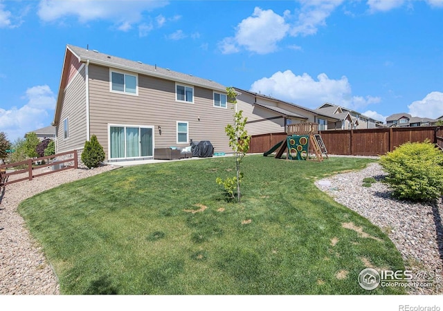 back of house featuring a playground