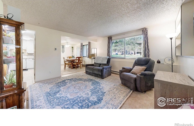 925 Columbia Rd Unit 614, Fort Collins, CO 80525 - living area with a textured ceiling, a baseboard radiator, and ceiling fan