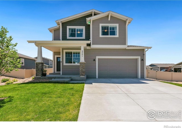 3751 Beech Tree St, Wellington, CO 80549 - craftsman-style house featuring a garage, concrete driveway, and covered porch