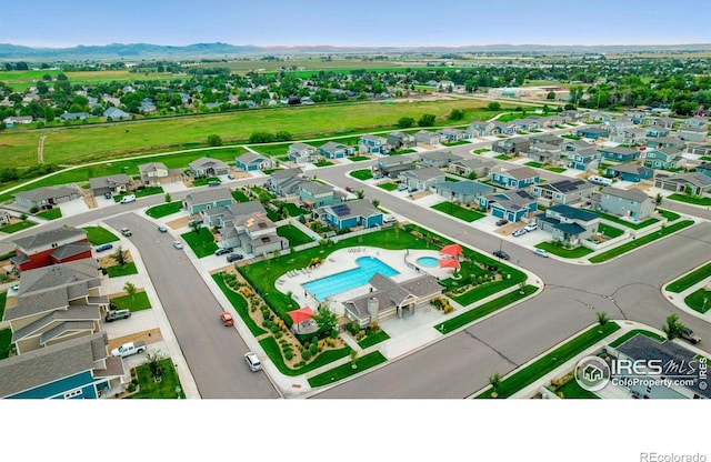 3751 Beech Tree St, Wellington, CO 80549 - aerial view of residential area with a pool and a mountainous background