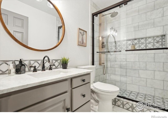 7726 Kit Fox Dr, Wellington, CO 80549 - bathroom with a stall shower, toilet, and vanity