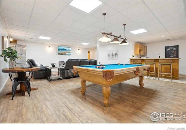 7726 Kit Fox Dr, Wellington, CO 80549 - rec room featuring light wood-style floors, a paneled ceiling, and billiards table