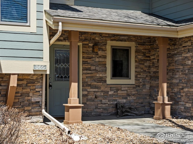 865 Crabapple Ln, Estes Park, CO 80517 - doorway to property with roof with shingles and stone siding