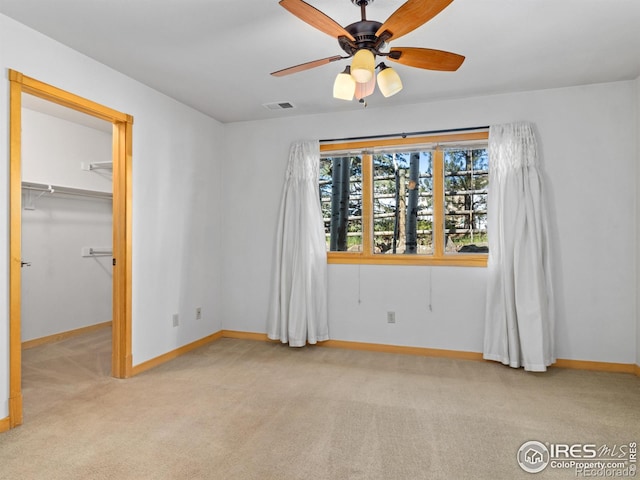 865 Crabapple Ln, Estes Park, CO 80517 - unfurnished bedroom with carpet flooring, baseboards, a walk in closet, and ceiling fan