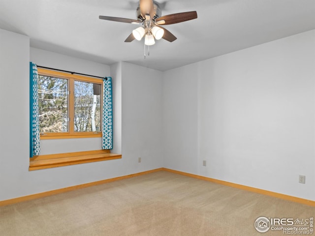 865 Crabapple Ln, Estes Park, CO 80517 - spare room with baseboards, carpet floors, and a ceiling fan