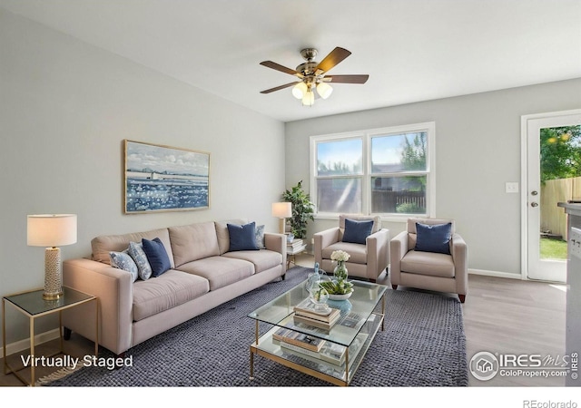 2136 3rd St SW Unit 3, Loveland, CO 80537 - living room with a ceiling fan, wood finished floors, and baseboards