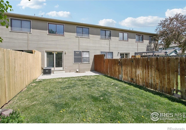 2136 3rd St SW Unit 3, Loveland, CO 80537 - back of property with central AC unit and a patio area