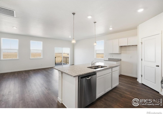 kitchen featuring stainless steel dishwasher, a sink, dark wood-style flooring, a center island with sink, and white cabinets