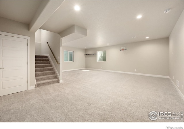 4532 Big Horn Pkwy, Johnstown, CO 80534 - basement featuring carpet floors, stairs, recessed lighting, and baseboards