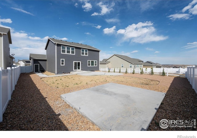 4532 Big Horn Pkwy, Johnstown, CO 80534 - back of property with a patio, a fenced backyard, and a residential view