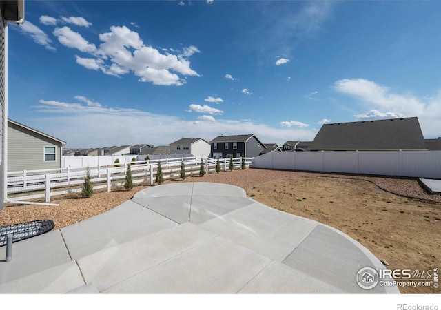 4532 Big Horn Pkwy, Johnstown, CO 80534 - view of patio / terrace with a fenced backyard and a residential view