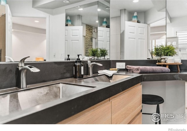 2001 James Dr, Loveland, CO 80538 - kitchen with a sink, recessed lighting, and dark countertops