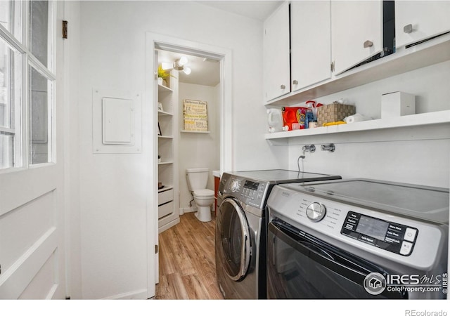 2001 James Dr, Loveland, CO 80538 - laundry room featuring washer and dryer and light wood-type flooring