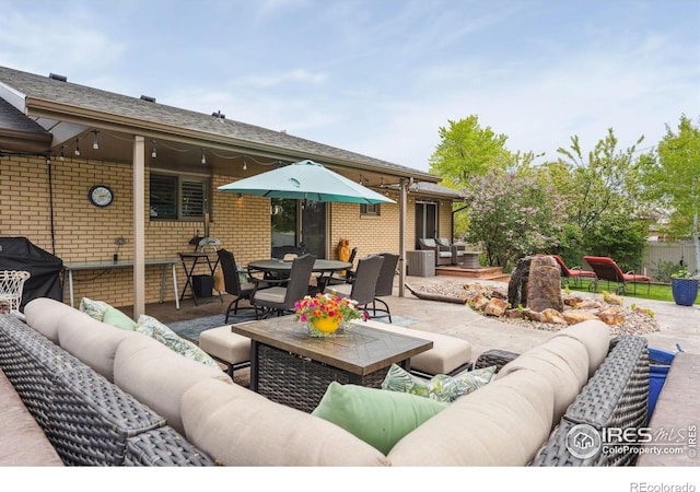2001 James Dr, Loveland, CO 80538 - view of patio featuring an outdoor hangout area and central AC