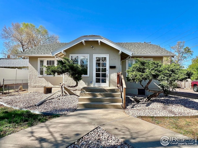 1219 16th St, Greeley, CO 80631 - bungalow-style house with stucco siding and a shingled roof