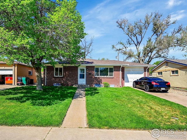 ranch-style home with brick siding, a garage, driveway, and a front lawn