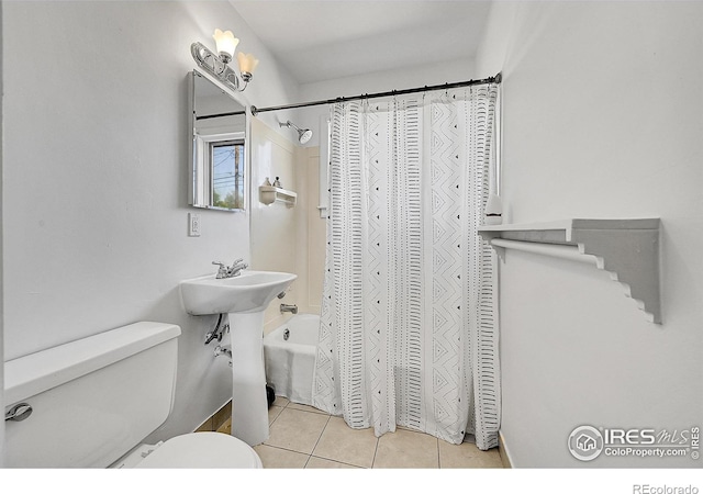 full bathroom with tile patterned flooring, toilet, and shower / bath combo