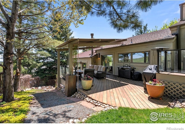 wooden deck featuring an outdoor hangout area
