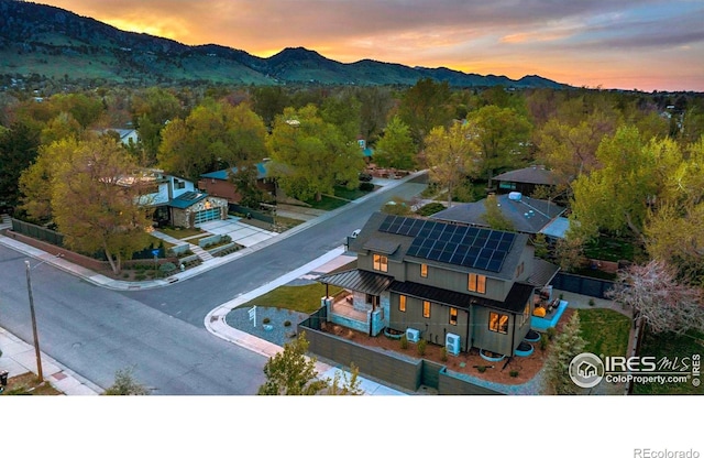 aerial view of property and surrounding area with a mountainous background