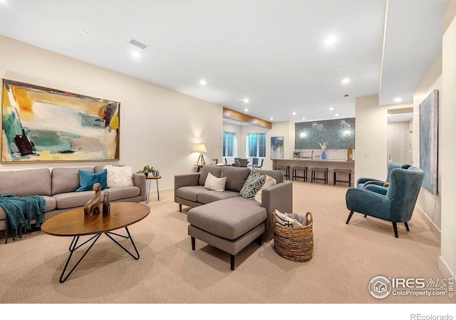 living room with carpet flooring, recessed lighting, and baseboards