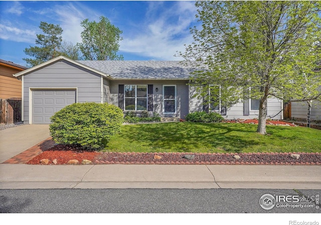 1201 Stein St, Lafayette, CO 80026 - single story home featuring an attached garage, concrete driveway, a front lawn, and roof with shingles
