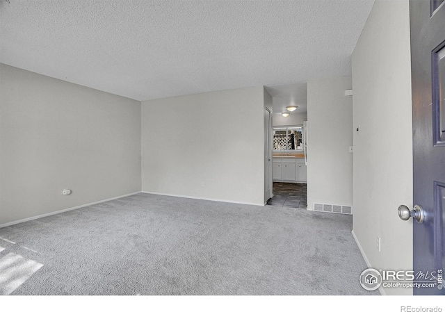1201 Stein St, Lafayette, CO 80026 - carpeted empty room with a textured ceiling and baseboards