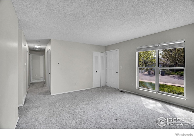 1201 Stein St, Lafayette, CO 80026 - empty room with carpet, a textured ceiling, and baseboards