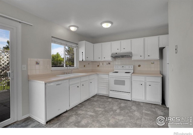 1201 Stein St, Lafayette, CO 80026 - kitchen featuring white appliances, under cabinet range hood, a sink, decorative backsplash, and white cabinetry