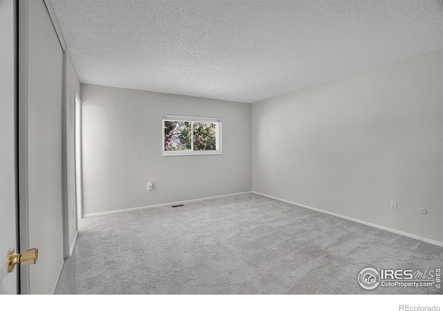 1201 Stein St, Lafayette, CO 80026 - carpeted empty room featuring a textured ceiling and baseboards
