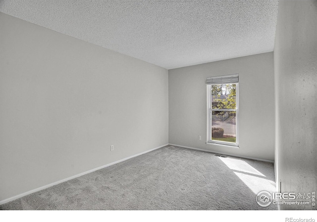1201 Stein St, Lafayette, CO 80026 - unfurnished room featuring carpet, a textured ceiling, and baseboards
