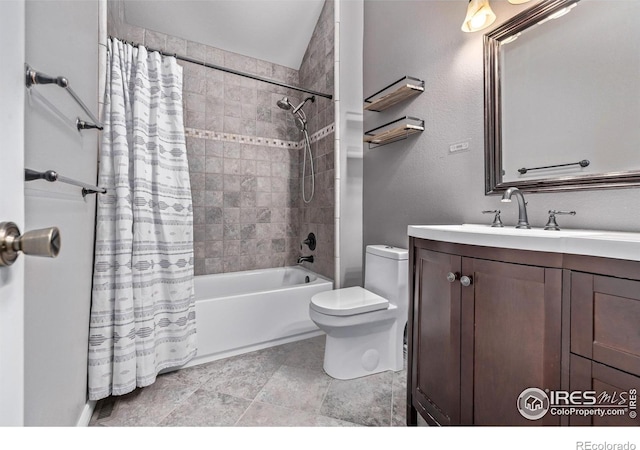 bathroom featuring toilet, vanity, and shower / bath combination with curtain