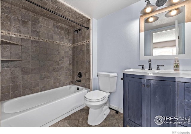 full bathroom featuring toilet, shower / tub combination, vanity, baseboards, and tile patterned floors