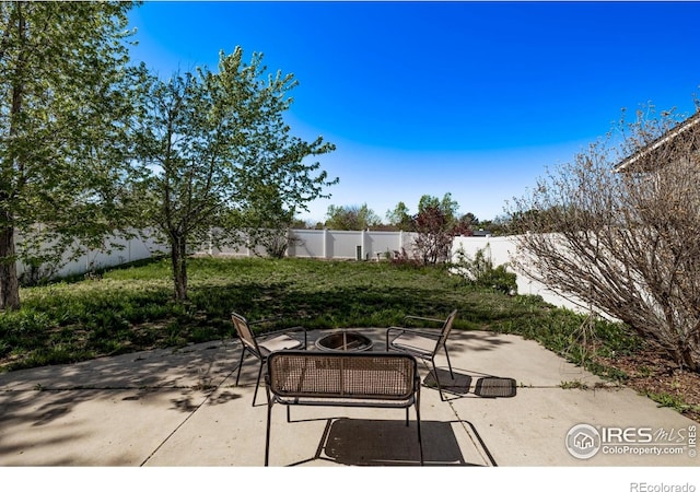 view of patio / terrace featuring an outdoor fire pit and a fenced backyard