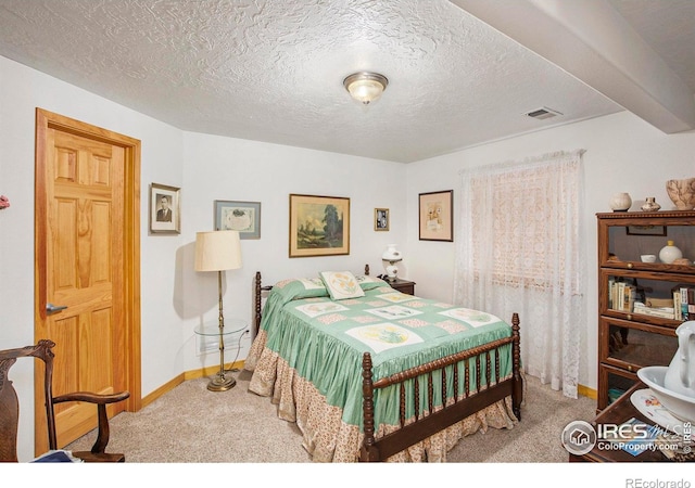 5049 W 2nd Street Rd, Greeley, CO 80634 - bedroom with carpet, baseboards, and a textured ceiling