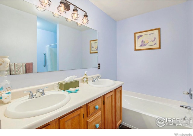 5049 W 2nd Street Rd, Greeley, CO 80634 - full bathroom with a garden tub, double vanity, and a shower