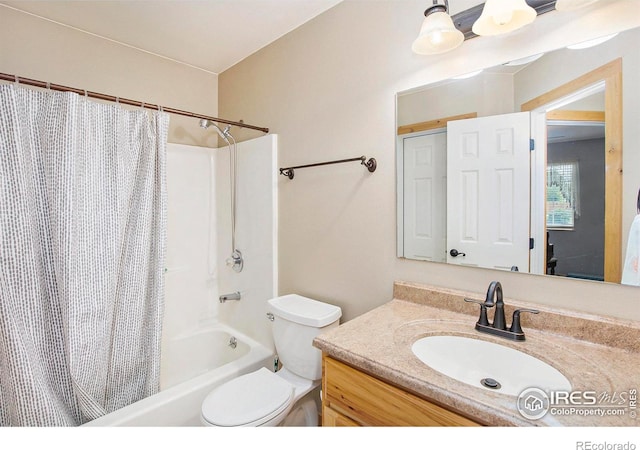 5049 W 2nd Street Rd, Greeley, CO 80634 - bathroom featuring shower / bath combo with shower curtain, vanity, and toilet