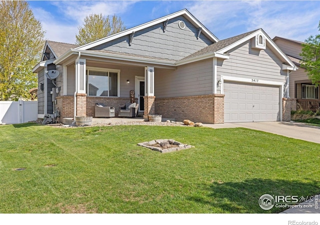 craftsman inspired home featuring brick siding, a garage, driveway, and an outdoor living space