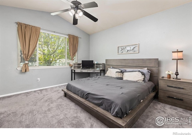 carpeted bedroom featuring vaulted ceiling, baseboards, and ceiling fan