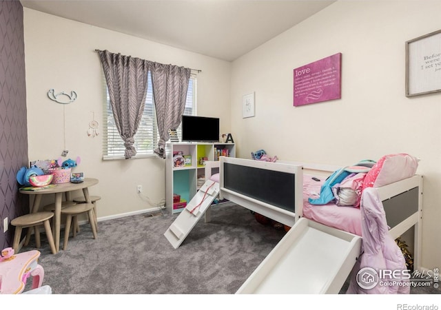recreation room with carpet and baseboards