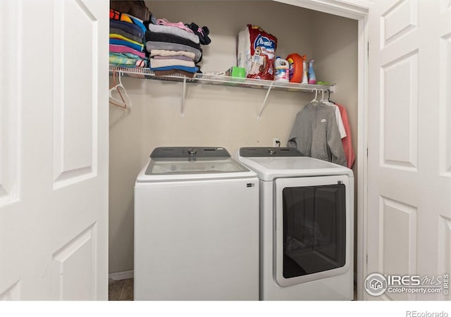 laundry area with independent washer and dryer