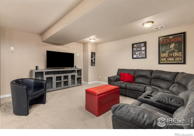 carpeted living area with baseboards