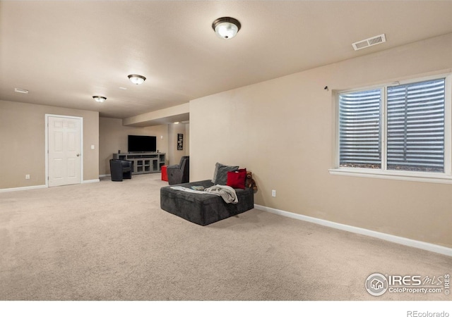 unfurnished room with baseboards and carpet