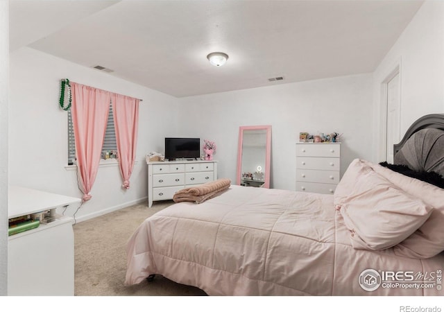 carpeted bedroom with baseboards